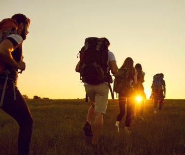 Group of hikers at sunset