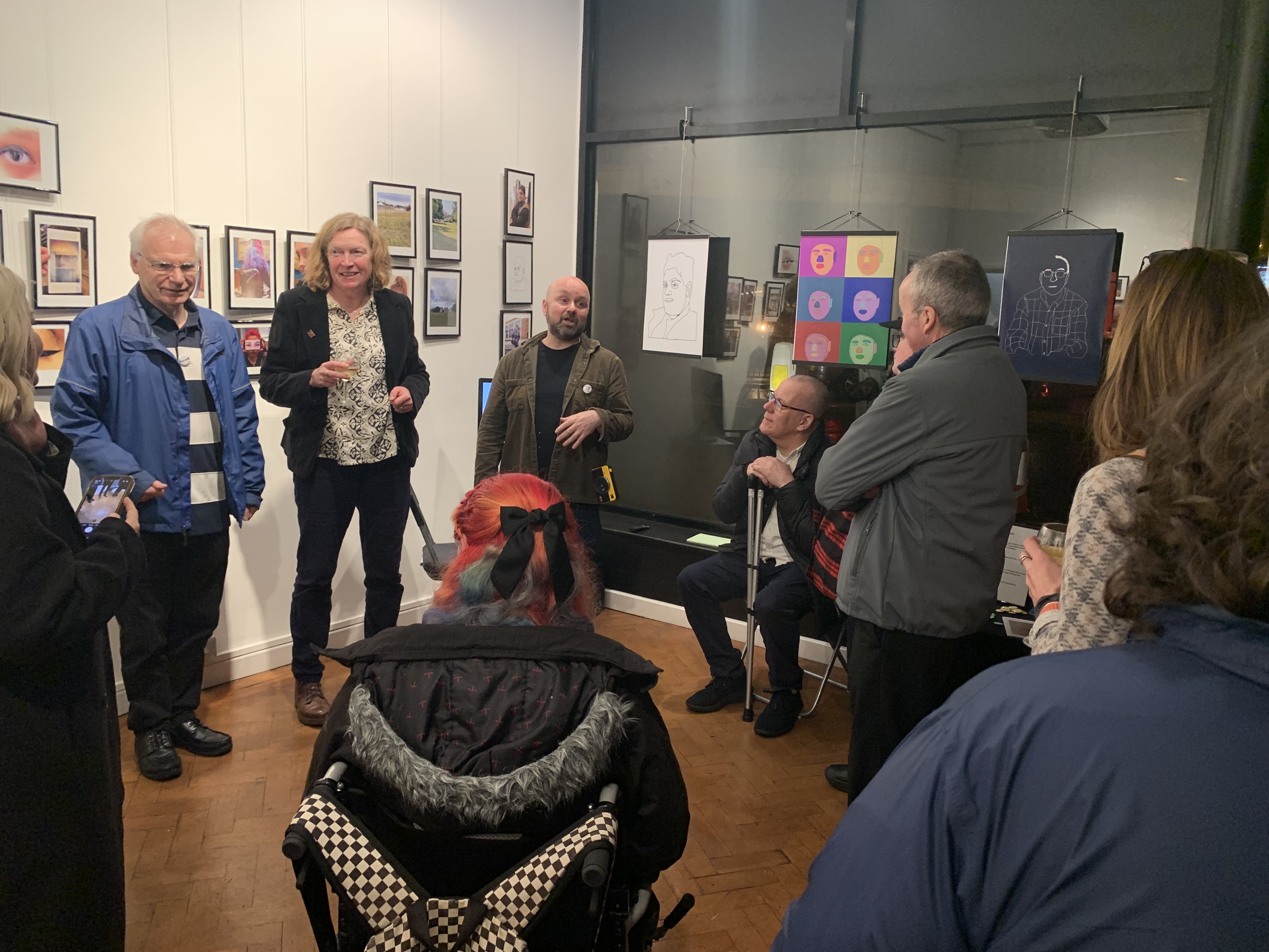 Photo of attendees at an art exhibition at Colonnade House in Worthing