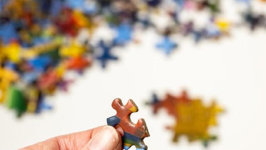 Person holding jigsaw piece Credit: Sharon Snider via Pexels