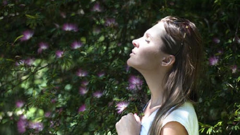 Woman smelling flowers